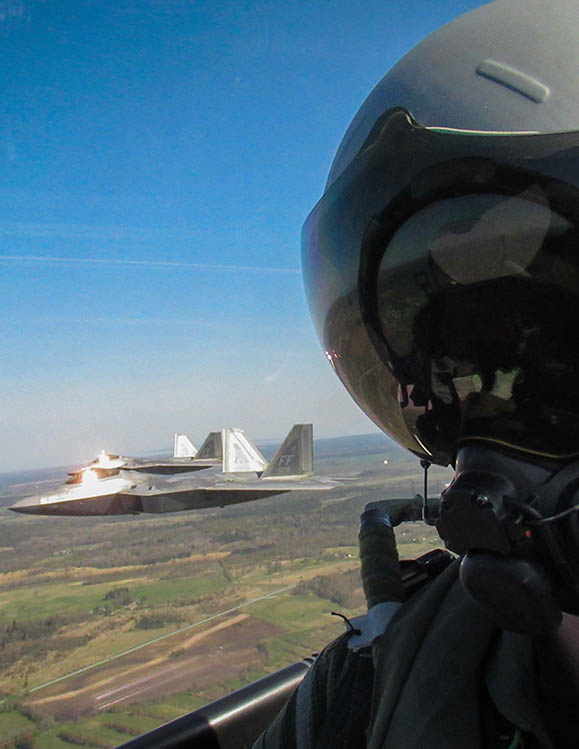 RAF Pilot in F35B airborne with other F35Bs beside