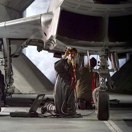 RAF Aircraft Technician (Avionics) working on underside of Typhoon jet