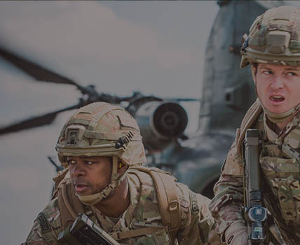 RAF Regiment Gunners exiting Chinook helicopter and preparing defensive positions