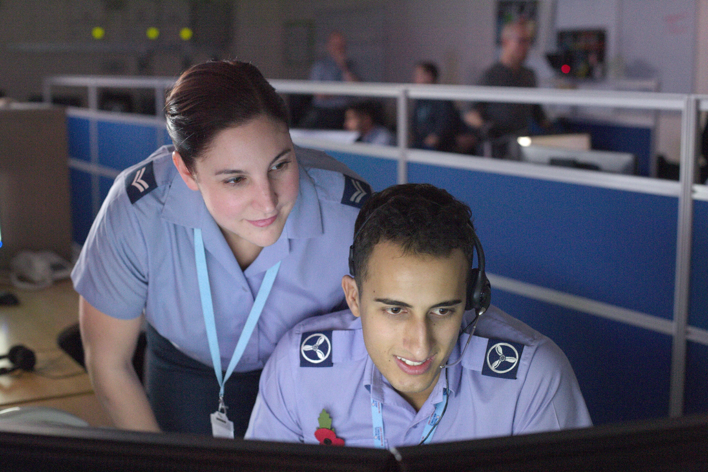 Female and male Cyberspace Communication specialists inspecting network traffic